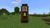 A functional grandfather clock using a bell (Image via Mojang)